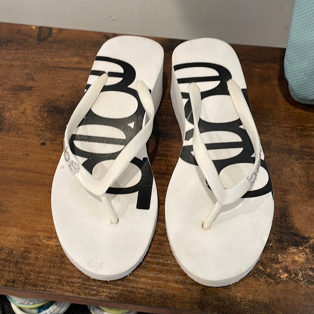 Bebe slides. One heels and one flat.